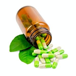 Capsules green in an open jar with leaf